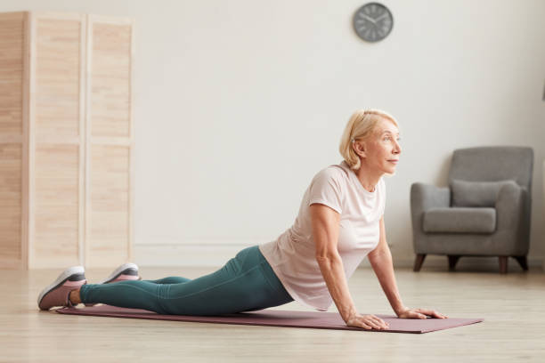 istock Woman stretching on the floor 1225828004