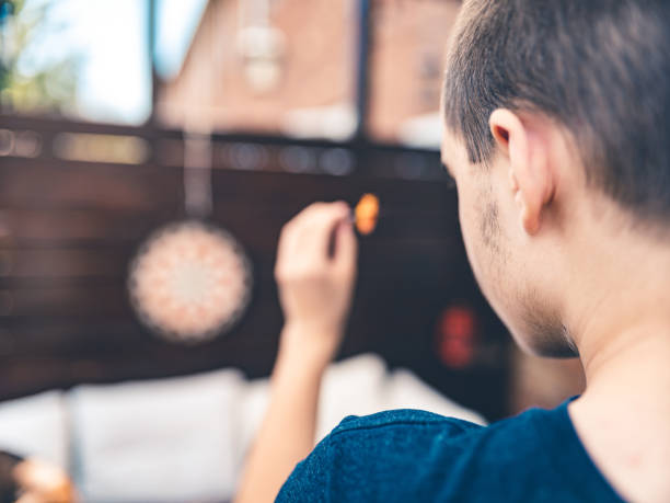 Teenager playing Darts outside