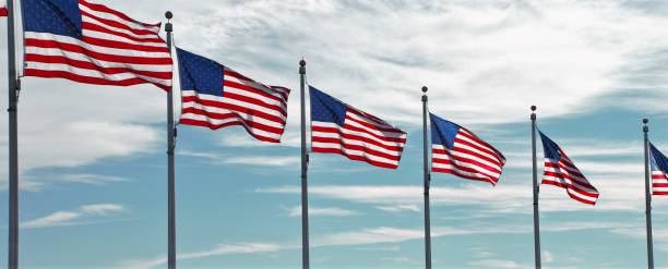 istock American flag banner with multiple USA flags unfurled in wind 1225831604