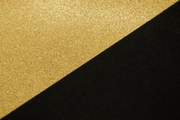 istock Split in the half of golden and black texture background 1225831872