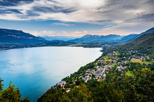 Elevated viewpoint over small French village of Bourdeau on the edge of Lake Bourget near Aix les Bains and Chambery city in Alps mountains