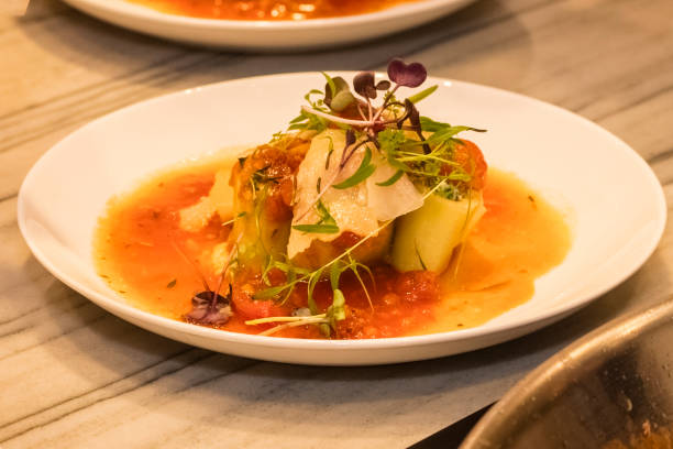 istock Cannelloni with delicate ricotta cream, cherry tomato sauce on a white plate 1225833500