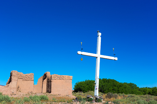 The Cross of the Martyrs against a blue sky on the hilltop in Santa Fe, New Mexico