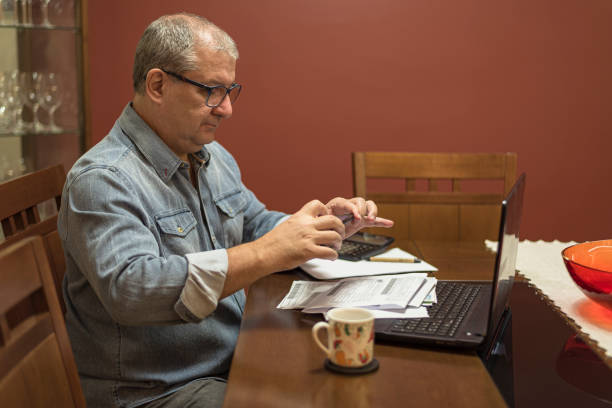 istock Adult man using cellphone for reading barcode and paying bills 1225836830