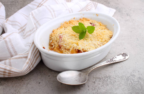 istock Crumble with strawberries and apples on a white plate 1225840516