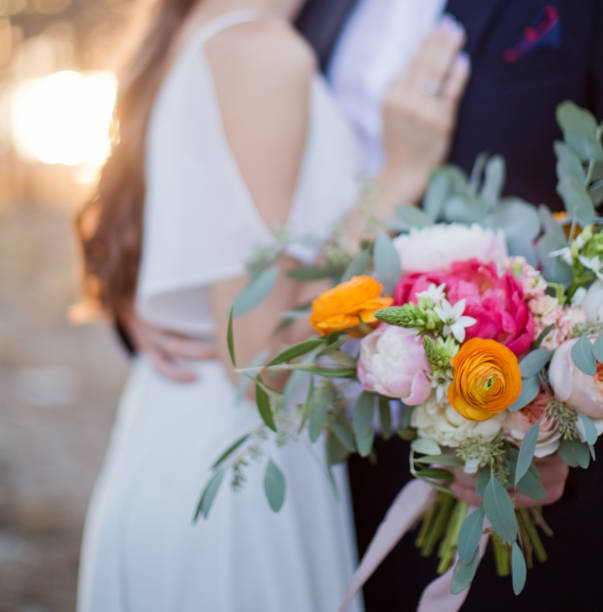 istock Bride and groom with boho bouquet 1225842665