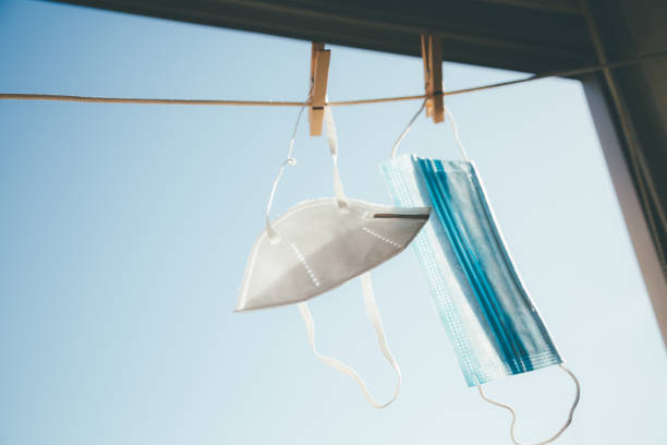 istock Protective masks hanging in the sun for disinfection 1225843624