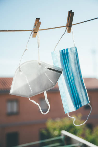 istock Protective masks hanging in the sun for disinfection 1225843626