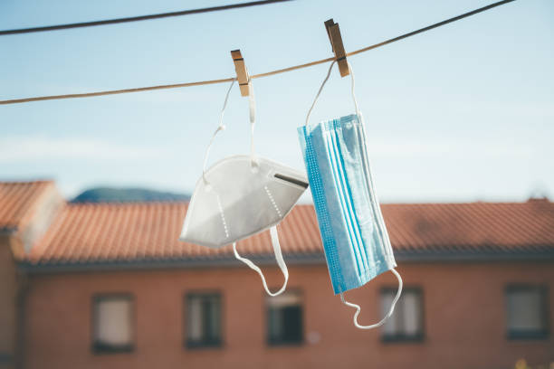 istock Protective masks hanging in the sun for disinfection 1225843628