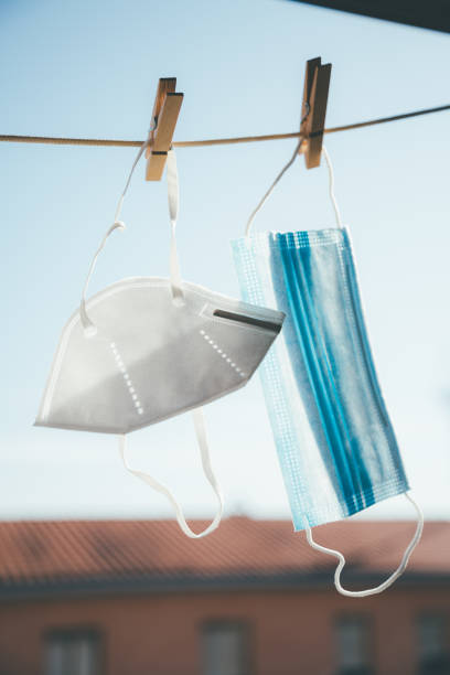 istock Protective masks hanging in the sun for disinfection 1225843634