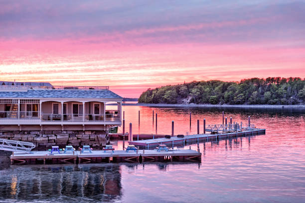 istock Downtown Bar Harbor village in summer during bright red sunset twilight with waterfront restaurant, pier 1225843748