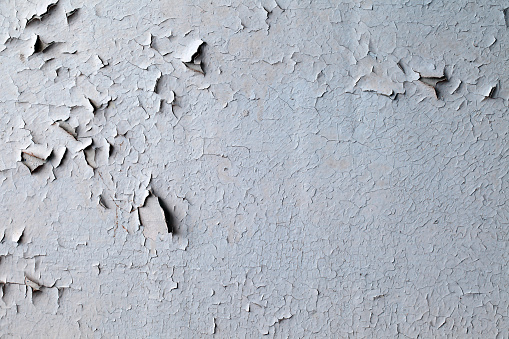 Old peeling paint on uneven surface