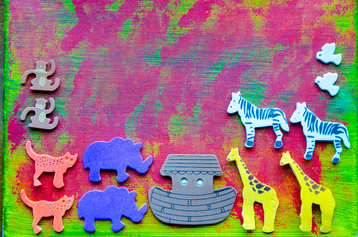 Noah's ark in foam stickers over a colorful painted background\n\nNOTE TO INSPECTOR: Background was drawn by myself