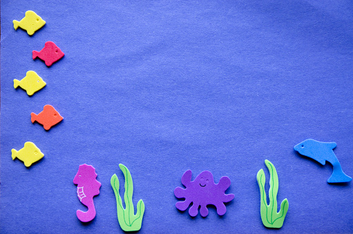 Marine life in foam stickers over a colorful background