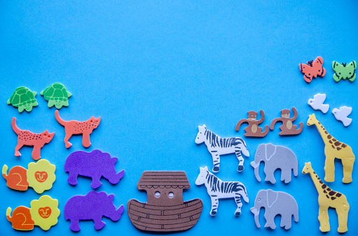 Noah's ark in foam stickers over a colorful background