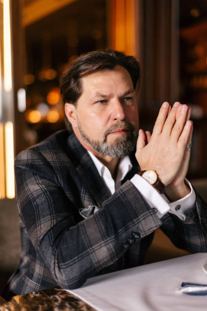 istock Bearded businessman thinks about important while sitting in leather armchair. 1225846288