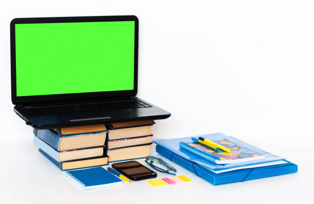 istock Work from home, mobile, green screen laptop computer, books and notebook. Education background, workplace at home during the pandemic. The quarantine concept of stay home stop coronavirus COVID-19 1225846676