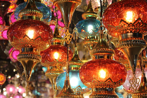 These handcrafted lamps/lanterns feature intricate shapes made of metal and glass materials, resulting in unique colors evocative of Arabian Nights and other legends of the Orient. These creations are highly prized in the Middle East and North Africa a region, especially during Islam's Ramadan, Eid Al Fitr and Eid Al Adha periods every year.