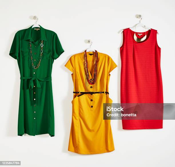 Fashionable Womens Clothing With Personal Accessories On Coathanger Stock Photo - Download Image Now