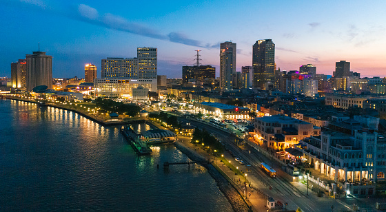 Aerial view of New Orleans with Mississippi River in French Quarter district during sunset