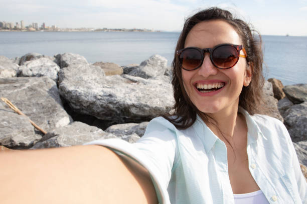 istock Smiling woman taking a selfie 1225848948