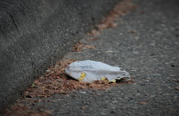 istock Covid19 coronavirus n95 masks litter the empty streets 1225849530