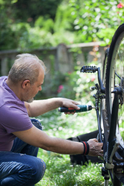 istock Man repairing bicycle 1225850576
