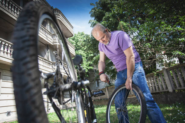 istock Man repairing bicycle 1225850888