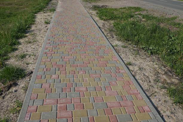 istock long alley of colored paving slabs 1225851457