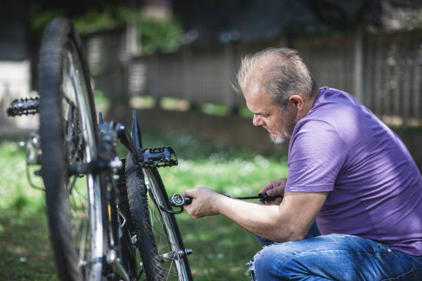 istock Man repairing bicycle 1225853649
