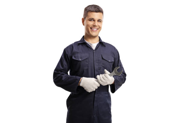 istock Smiling young mechanic holding a wrench isolated on white background 1225854860