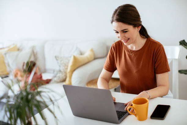 istock Mother and daughter working together at home 1225856235