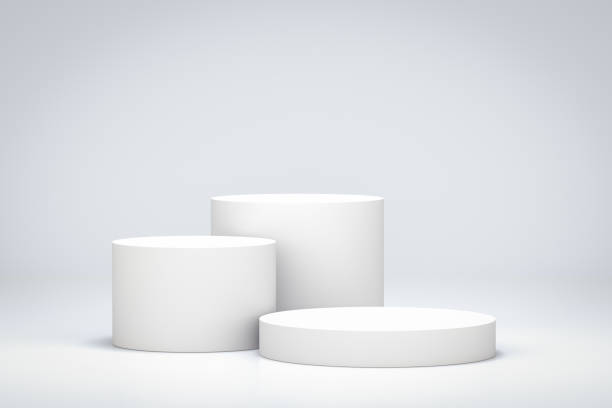 istock White room with blank product shelf standing backdrop. Empty podium or pedestal display with cylinder stand concept. 3D illustration. 1225856295