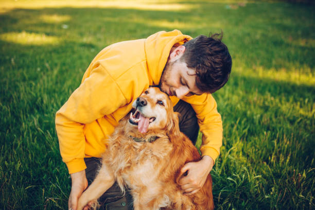 istock Guy and his dog, Golden Retriever, courtyard 1225858269
