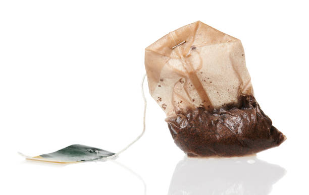 istock one used tea bag, macro photo high detailed, isolated object on a white background 1225858837