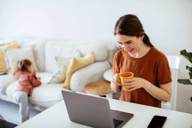 istock Mother and daughter working together at home 1225860228