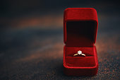 Still life with engagement ring in velvet gift box