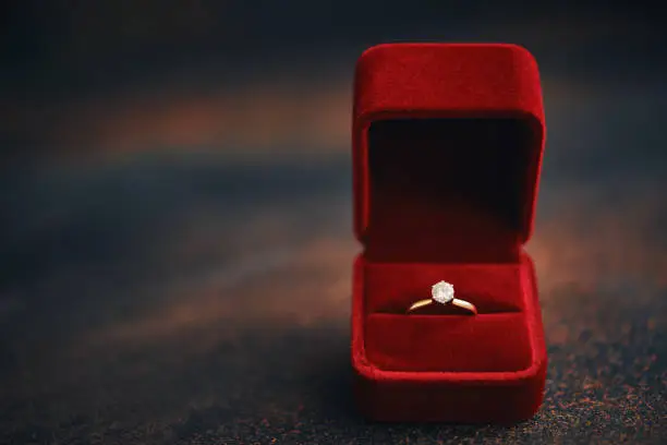 Valentine's Day still life with engagement ring in velvet gift box