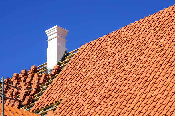 restoration of a historic wooden house and replacement of roof clay tiles - roof repairing tile construction imagens e fotografias de stock