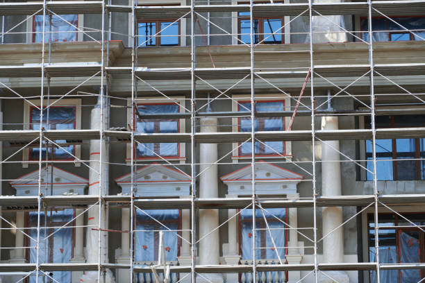 istock scaffolding at the facade of a building under construction, multi-storey building, without people 1225861833