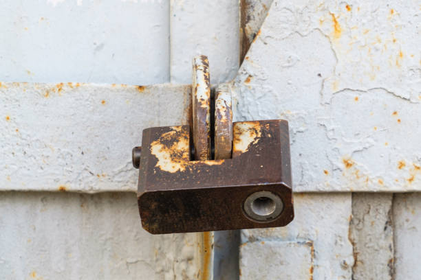 istock aged rusted metall gate closed steel old padlock safety 1225862580