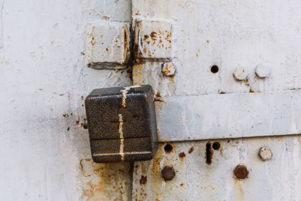 istock aged rusted metall gate closed steel old padlock safety 1225862596