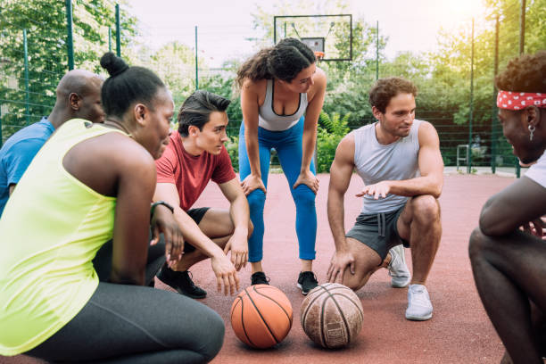 istock Sports people discussing game plan on ground 1225862773