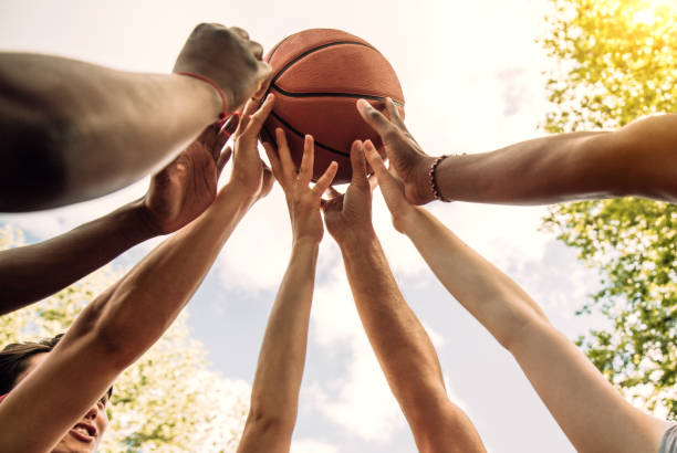 istock Multi-ethnic friends holding basketball 1225862969