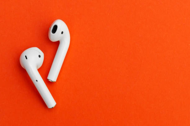 Wireless headphones on bright background.
