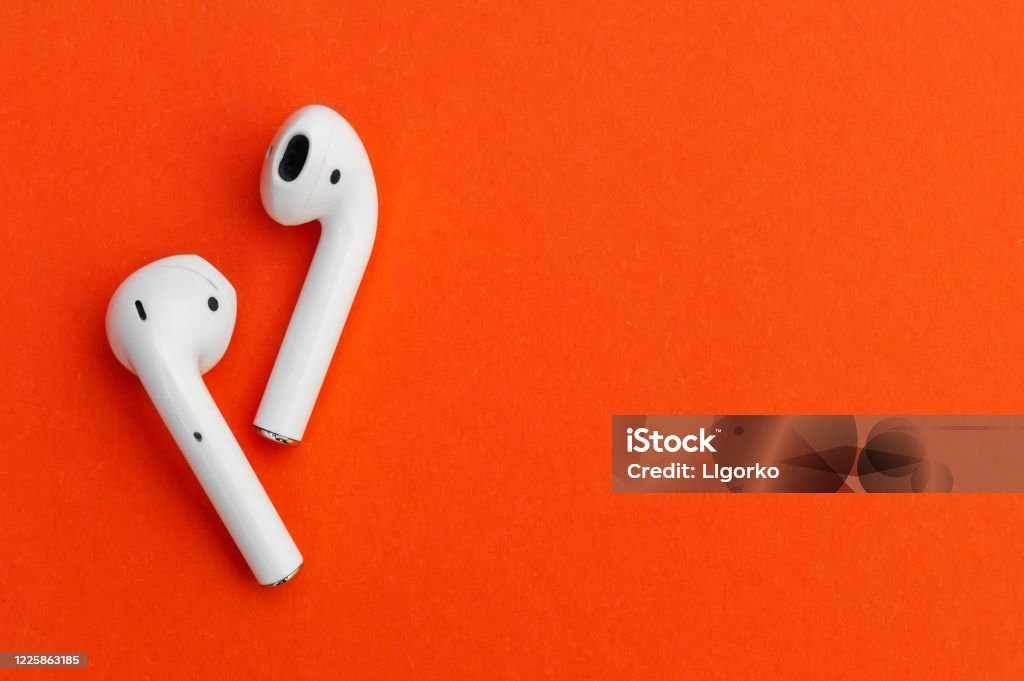Wireless headphones on bright background. Headphones Stock Photo