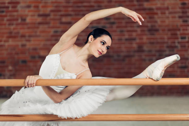 istock motivated ballerina with raised leg performing some movements 1225864635