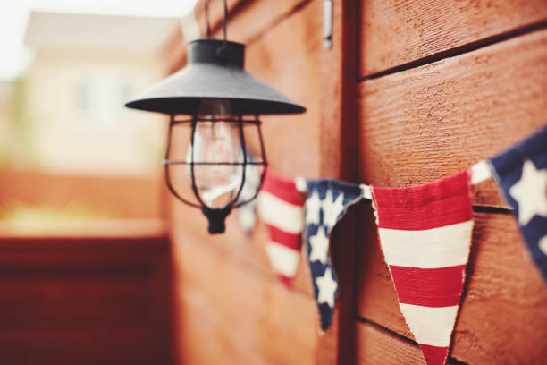 American flag background. Flag bunting hanging on fence
