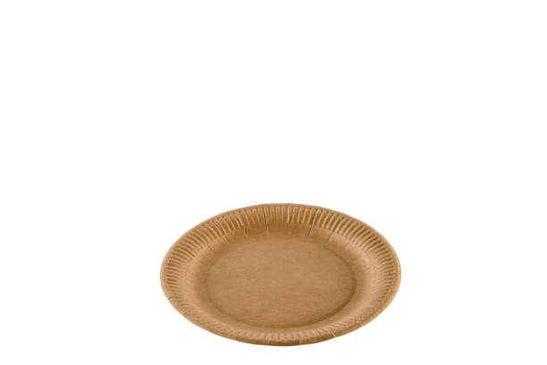 istock Eco-friendly natural plate with empty space. Disposable ecological utensils on white background. Sustainability of planet. Closeup isolated cardboard plate made of fiber of bamboo and bagasse. 1225867417
