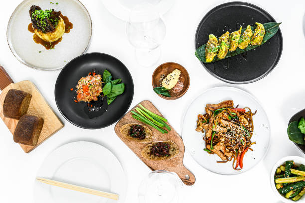 istock Assorted Chinese food set. Noodles, fried rice, dumplings, peking duck, dim sum, spring rolls. Famous dishes on table.  Gray background. Top view. 1225869787